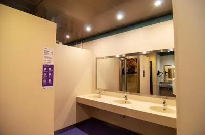 a bathroom with two sinks and a large mirror at Kabul Party Hostel Barcelona in Barcelona