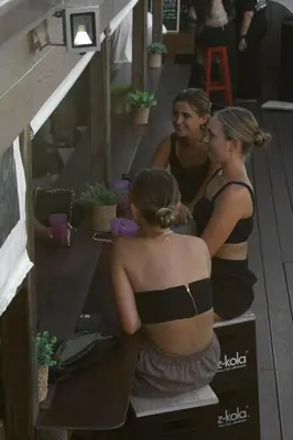 a group of women in bathing suits getting their hair at Kabul Party Hostel Barcelona in Barcelona