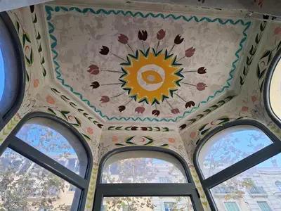 a ceiling with a flower painted on it at Mediterranean Hostel Barcelona in Barcelona