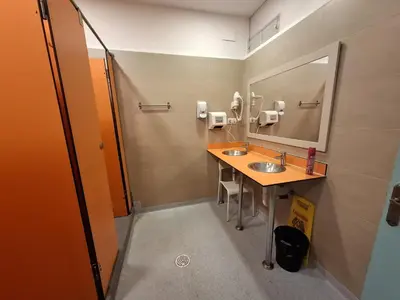 a bathroom with two sinks and a mirror at Mediterranean Hostel Barcelona in Barcelona