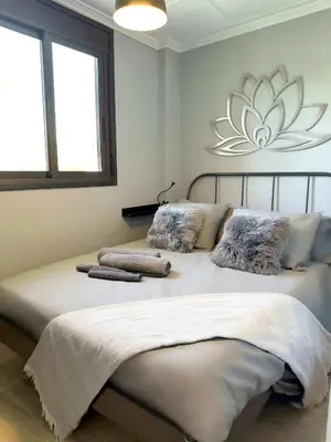 a bedroom with two beds with pillows on them at 8 min walk to the beach & 10 min walk to Convention Centre ! in Barcelona
