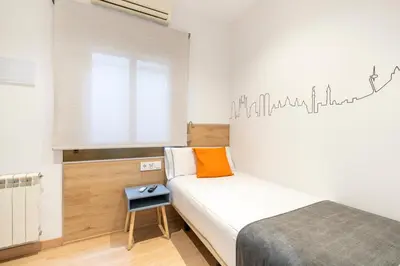 a bathroom with a sink and a shower at Hostal Sans in Barcelona