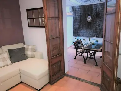 a living room with a couch and a table at Top Barcelona Apartments in Barcelona