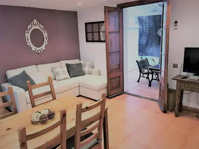a living room with a couch and a table at Top Barcelona Apartments in Barcelona