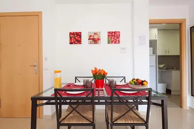 a dining room table with fruits and vegetables on it at Charmsuites Nou Rambla in Barcelona