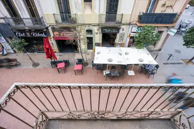 an overhead view of a table and chairs on a city street at Apartament Clot 1 in Barcelona
