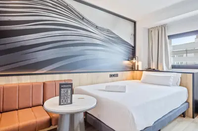 a hotel room with a bed and a table at Andante Hotel in Barcelona
