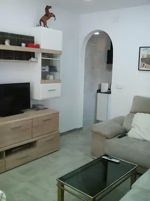 a living room with a couch and a coffee table at Piso luminoso en Barcelona in Barcelona