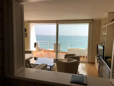 a living room with a view of the ocean at Llevant - Vistas espectaculares in San Pol de Mar