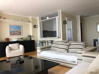 a living room with a couch and a table at Llevant - Vistas espectaculares in San Pol de Mar