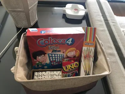 a basket filled with legos and other toys on a table at Ponent - Espectaculares vistas al mar in San Pol de Mar