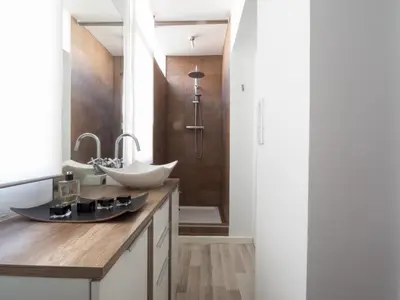 a bathroom with a sink and a shower at Penthouse Sitges in Sitges