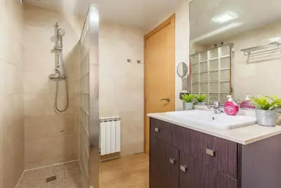a bathroom with a sink and a shower at Casa Lourdes in Canyelles