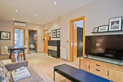 a living room with a large flat screen tv at Alcam Alio 2 in Barcelona