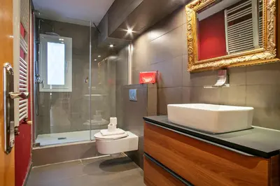 a bathroom with a sink and a toilet and a shower at Alcam Alio 2 in Barcelona