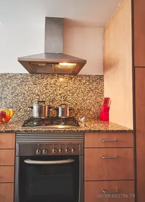 a kitchen with a stove with two pots on it at Alcam Badalona Playa Norte in Badalona