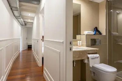 a bathroom with a toilet and a sink at Enjoybcn Dali Apartments in Barcelona