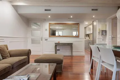 a living room with a couch and a table at Enjoybcn Dali Apartments in Barcelona