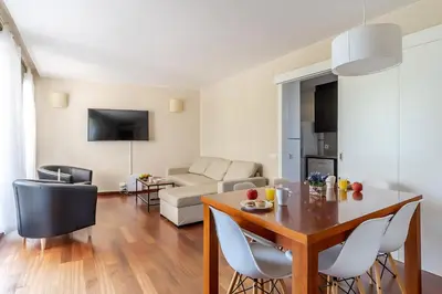 a living room with a table and a couch at 4131 - AB Diagonal - Sant Adrià de Besòs in Sant Adria de Besos