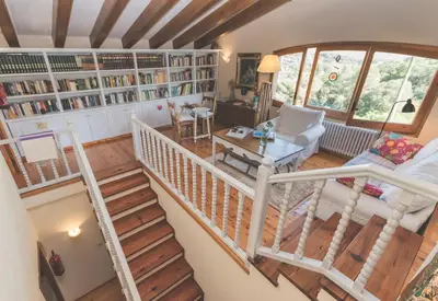an overhead view of a living room with a staircase at Can Caponet in Lliçà d'Amunt