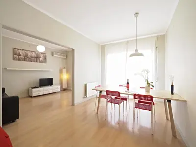 a dining room with a table and chairs at Sagrada Penthouse in Barcelona