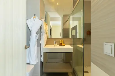 a bathroom with a sink and a mirror at Cosmo Suite Penthouse in Barcelona