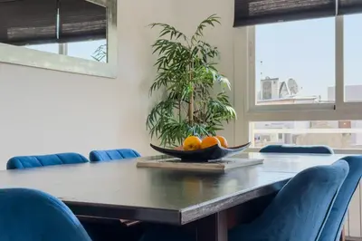 a table with chairs and a bowl of fruit on it at Penthouse City Center With 2 Terraces And Views in Barcelona