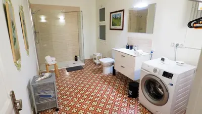 a bathroom with a washer and a washing machine in it at MARISOL SEAVIEW & BEACH - apartment in Masnou