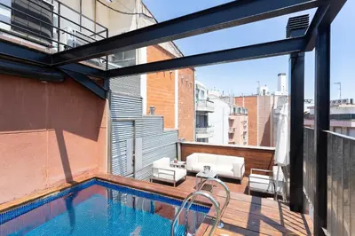 a balcony with a swimming pool on a building at My Space Barcelona Pool City Center in Barcelona