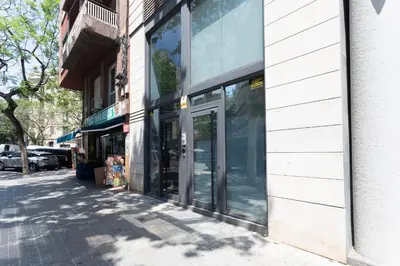 a store front with glass doors on a city street at My Space Barcelona Pool City Center in Barcelona