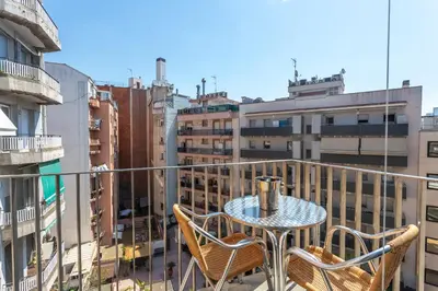 a table and chairs on a balcony with a view at My Space Barcelona Pool City Center in Barcelona
