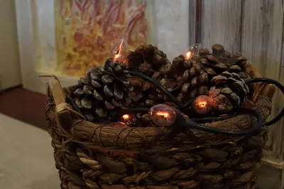 a basket full of pine cones and candles at Anita's Bed and Breakfast in Barcelona