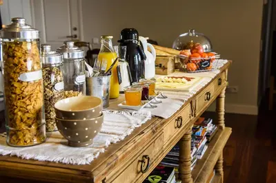 a wooden table with food on top of it at Anita's Bed and Breakfast in Barcelona