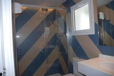 a bathroom with a shower and a sink at Apartamentos Sunway Arizona in Sitges