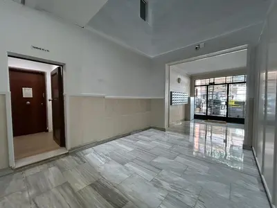 an empty room with a hallway with a door at BarcelonaForRent Sant Pau Suite in Barcelona