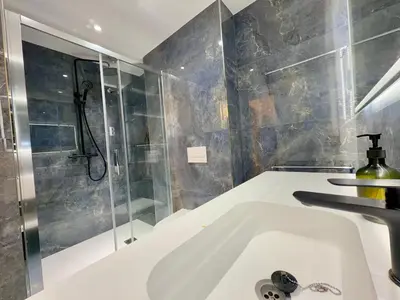 a bathroom with a sink and a shower at BarcelonaForRent Sant Pau Suite in Barcelona