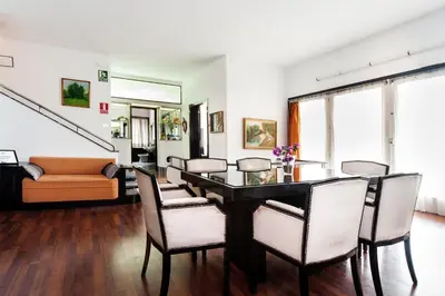 a dining room with a table and chairs at Casa Vilaró Park Guell in Barcelona