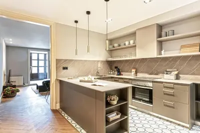 a kitchen with a large island in the middle at Weflating City Center in Barcelona