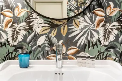 a bathroom with a sink and a mirror at Weflating City Center in Barcelona