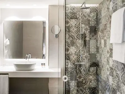 a bathroom with a sink and a shower at Mercure Barcelona Condor in Barcelona