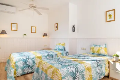 two beds sitting next to each other in a room at Antonio's House in Sitges
