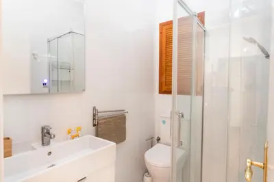 a bathroom with a toilet and a sink and a shower at Antonio's House in Sitges
