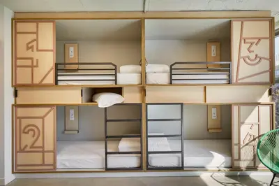 a bunk room with four bunk beds in it at Unite Hostel Barcelona in Barcelona