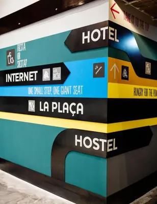 a wall with a sign for a hotel at Generator Barcelona in Barcelona