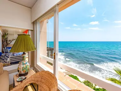 a room with a window with a view of the ocean at Apartment Acuario by Interhome in Sant Andreu de Llavaneres