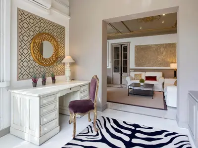 a living room with a desk and a bedroom at HoHomes - Centric Design Apartment in Barcelona