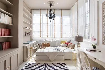 a living room with a couch and a table at HoHomes - Centric Design Apartment in Barcelona