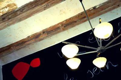 a group of lights hanging from a ceiling with hearts at Apartamentos El Pintor in Barcelona