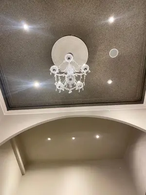 a ceiling with a chandelier in a room at Hostal Orleans in Barcelona