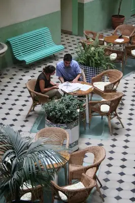 a man and a woman sitting at a table at Hotel Peninsular in Barcelona